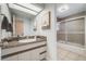 Clean bathroom featuring a granite vanity and shower with tile surround at 2773 S Macon St, Aurora, CO 80014
