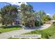 Charming two-story home with brick accents, lush landscaping, and a spacious driveway at 2773 S Macon St, Aurora, CO 80014