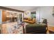 Cozy living room with hardwood floors, colorful rug, modern decor and open floorplan at 2773 S Macon St, Aurora, CO 80014