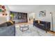 Comfortable living room with built-in bookshelves and a gray loveseat at 2773 S Macon St, Aurora, CO 80014