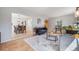 Open-concept living and dining area with hardwood floors and natural light at 2773 S Macon St, Aurora, CO 80014