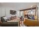 Cozy living room with hardwood floors, colorful rug, modern decor and open floorplan at 2773 S Macon St, Aurora, CO 80014