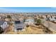 Aerial view showcases the property's backyard, neighborhood, and proximity to city amenities at 10286 Rotherwood Cir, Highlands Ranch, CO 80130