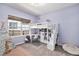 Charming bedroom featuring a loft bed with a built-in desk and ample storage space at 10286 Rotherwood Cir, Highlands Ranch, CO 80130