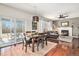 Open concept dining area flowing into living room, with view to the backyard at 10286 Rotherwood Cir, Highlands Ranch, CO 80130