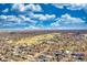 Expansive aerial view of the neighborhood featuring a golf course and beautiful clear blue sky with clouds at 2044 N High St, Denver, CO 80205