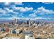 A beautiful cityscape view featuring modern buildings and scenic mountains in the background at 2044 N High St, Denver, CO 80205