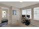 Bedroom featuring a desk with dual monitors and a window with horizontal blinds at 2044 N High St, Denver, CO 80205