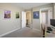 Bedroom featuring artwork, neutral paint, and a doorway into an adjoining space at 2044 N High St, Denver, CO 80205