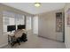 Bright bedroom featuring a desk with dual monitors and a built-in wardrobe with shelving at 2044 N High St, Denver, CO 80205
