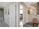 Hallway with doorways into different rooms featuring neutral paint and contemporary decor at 2044 N High St, Denver, CO 80205