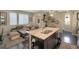 Open floor plan featuring a living room with a fireplace, kitchen, and dining area at 2044 N High St, Denver, CO 80205
