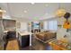 Open floor plan featuring a living room with a fireplace, kitchen, and dining area at 2044 N High St, Denver, CO 80205