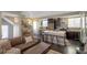 Open floor plan featuring a living room with a fireplace, kitchen, and dining area at 2044 N High St, Denver, CO 80205