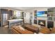 Open floor plan featuring a living room with a fireplace, kitchen, and dining area at 2044 N High St, Denver, CO 80205