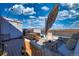 Rooftop deck featuring an umbrella, string lights, and an outdoor grill at 2044 N High St, Denver, CO 80205