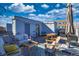 Rooftop deck featuring an outdoor grill, string lights, and patio furniture at 2044 N High St, Denver, CO 80205