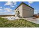 Backyard featuring a concrete patio with an outdoor dining set and a grill for entertaining at 2201 Monte Vista St, Fort Lupton, CO 80621