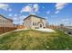 A well-maintained backyard features a concrete patio, an outdoor table set, and ample space at 2201 Monte Vista St, Fort Lupton, CO 80621
