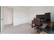 Bedroom with large desk and executive chair, carpeted flooring, and neutral wall color at 2201 Monte Vista St, Fort Lupton, CO 80621