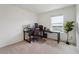 Bedroom with desk, computer setup, and a large window overlooking a natural landscape at 2201 Monte Vista St, Fort Lupton, CO 80621