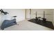 Home exercise area with exercise bike and weight bench; a fitness enthusiast's dream at 2201 Monte Vista St, Fort Lupton, CO 80621