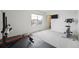 Bright home exercise room with workout equipment and plenty of natural light at 2201 Monte Vista St, Fort Lupton, CO 80621