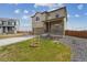 A charming two-story home featuring a well-manicured lawn and covered front porch at 2201 Monte Vista St, Fort Lupton, CO 80621