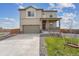 Charming two-story home featuring a covered front porch and attached two-car garage at 2201 Monte Vista St, Fort Lupton, CO 80621