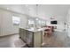 Bright, open-concept kitchen flows to dining and living area; great for entertaining at 2201 Monte Vista St, Fort Lupton, CO 80621