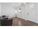 Bright living room with hardwood floors, elegant wall paneling, and stylish seating arrangements at 2201 Monte Vista St, Fort Lupton, CO 80621