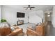 Living room with leather sofas, white walls, and a view to the stairway at 2201 Monte Vista St, Fort Lupton, CO 80621