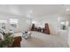 Bright living room with plush carpet, perfect for relaxing or entertaining guests at 2201 Monte Vista St, Fort Lupton, CO 80621
