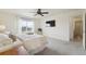 Main bedroom with large bed and window, bedside table and access to the ensuite bathroom at 2201 Monte Vista St, Fort Lupton, CO 80621