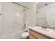 Bright full bathroom with modern vanity, shower-tub combo, and contemporary fixtures at 5957 Turnstone Pl, Castle Rock, CO 80104