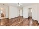 Spacious bedroom with hardwood floors, ceiling fan, closet, and en-suite bathroom at 5957 Turnstone Pl, Castle Rock, CO 80104