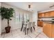 Bright dining area with tile floors and plenty of natural light at 5957 Turnstone Pl, Castle Rock, CO 80104