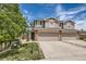 Charming two-story townhome with a two-car garage, lovely yard and stone accents at 5957 Turnstone Pl, Castle Rock, CO 80104