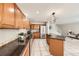 Open kitchen with tile floors, stainless appliances and granite countertops at 5957 Turnstone Pl, Castle Rock, CO 80104