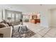 Spacious living room with tile floors and an open floor plan at 5957 Turnstone Pl, Castle Rock, CO 80104