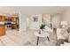 Open floor plan featuring kitchen with stainless steel appliances and cozy living room with staircase at 5957 Turnstone Pl, Castle Rock, CO 80104
