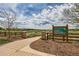Mitchell Creek Trailhead with sign and paved path for walking and outdoor activities at 5957 Turnstone Pl, Castle Rock, CO 80104