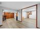 Open basement with laminate flooring and wood trim at 5531 S Telluride Ct, Centennial, CO 80015