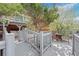 Multi-level deck with a bridge-like walkway and seating area at 5531 S Telluride Ct, Centennial, CO 80015