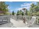 Outdoor deck featuring a patio heater and lounge chair with a view of the trees and sky at 5531 S Telluride Ct, Centennial, CO 80015