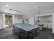 Spacious basement gym area with ping pong table and weightlifting equipment at 5531 S Telluride Ct, Centennial, CO 80015