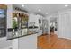 Bright kitchen with granite countertops, white cabinets, and stainless steel appliances at 5531 S Telluride Ct, Centennial, CO 80015
