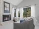 Inviting living room featuring a fireplace with ample natural light, and comfortable seating at 5531 S Telluride Ct, Centennial, CO 80015