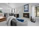 Stylish living area with a cozy fireplace, comfortable seating, and an adjacent dining area at 5531 S Telluride Ct, Centennial, CO 80015