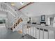 Bright, open-concept living area with vaulted ceilings, a fireplace, and a staircase at 5531 S Telluride Ct, Centennial, CO 80015
